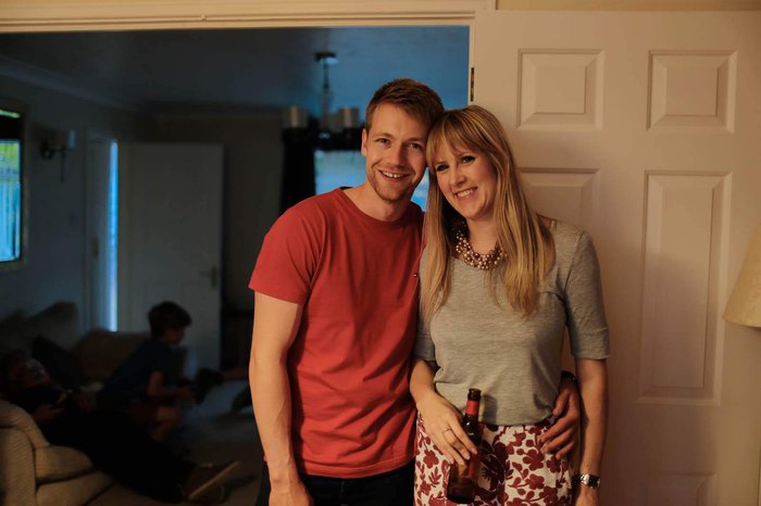 Emma, who was diagnosed with acute lymphoblastic leukaemia in 2015 stood in her home with her partner, drinking a bottle of beer.