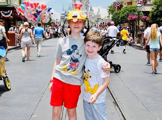 Hugo, who was diagnosed with acute lymphoblastic leukaemia (ALL), at Disney World, stood in front of the palace at Magic Kingdom.