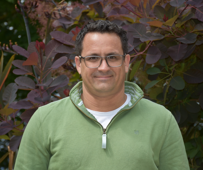 Headshot of Professor Ian Hitchcock smiling at the camera