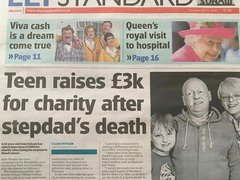 Photo of the Ely Standard with the headline 'Teen raises £3K for charity after stepdad's death' with black and white photo of Jake Moules and his stepdad.