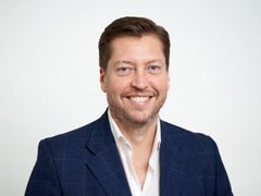 Man smiling in a suit