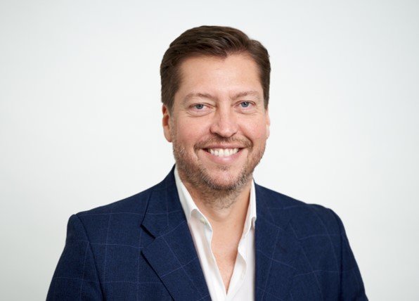 Man smiling in a suit