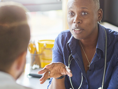 A doctor speaks to a patient