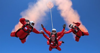 Paul, who lives with chronic myeloid leukaemia (CML), skydives surrounded by instructors. The picture is taken from below by a fellow skydiver.
