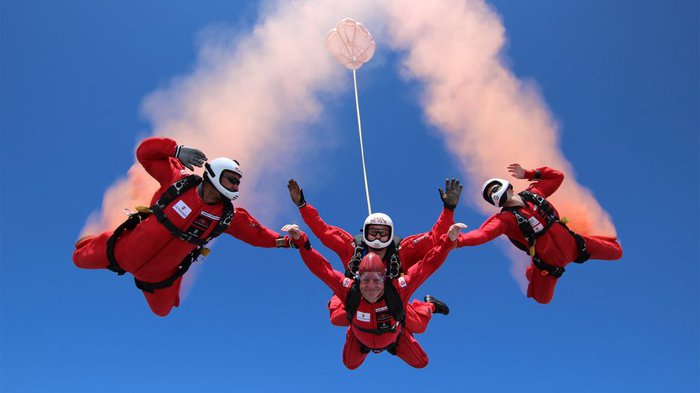 Paul, who lives with chronic myeloid leukaemia (CML), skydives surrounded by instructors. The picture is taken from below by a fellow skydiver.