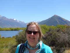 Photo of Carole outside on a hike smiling