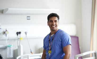 An image of a nurse in uniform working at a hospital.