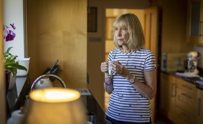 Ann Bromley, seen here holding a hot drink and looking out the window, was diagnosed with high-grade non-Hodgkin lymphoma (NHL) when she was 46 years old.