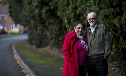 Louise, an ambassador with hodgkin lymphoma standing next to a man both smiling at the camera.