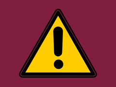 A warning icon of a yellow triangle with a black exclamation mark, on a maroon background.
