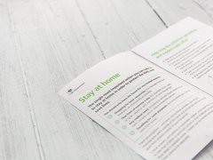 A stock image of an open page of a Government leaflet with advice about staying at home.