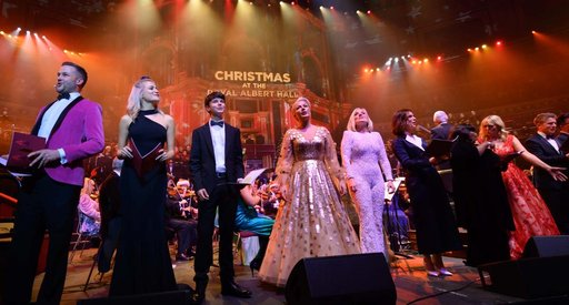 Celebritiies on stage at the Royal Albert Hall, with a sign in the background saying 'Christmas at the Royal Albert Hall' during a performance of Christmas with the Stars.
