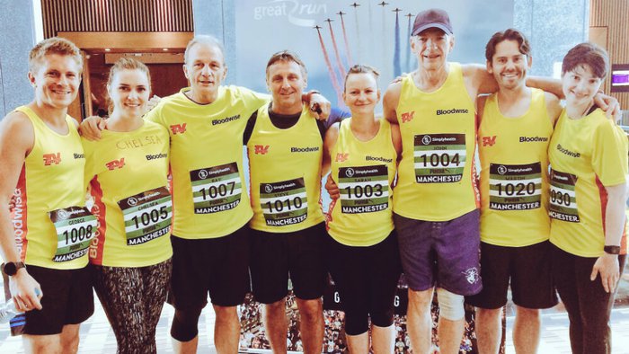 Casualty star George Rainsford with the running team. All 8 runners are wearing Bloodwise vests