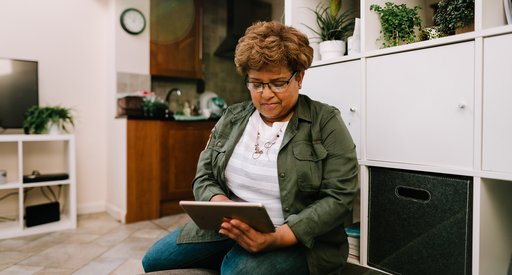 A woman looking at a tablet computer